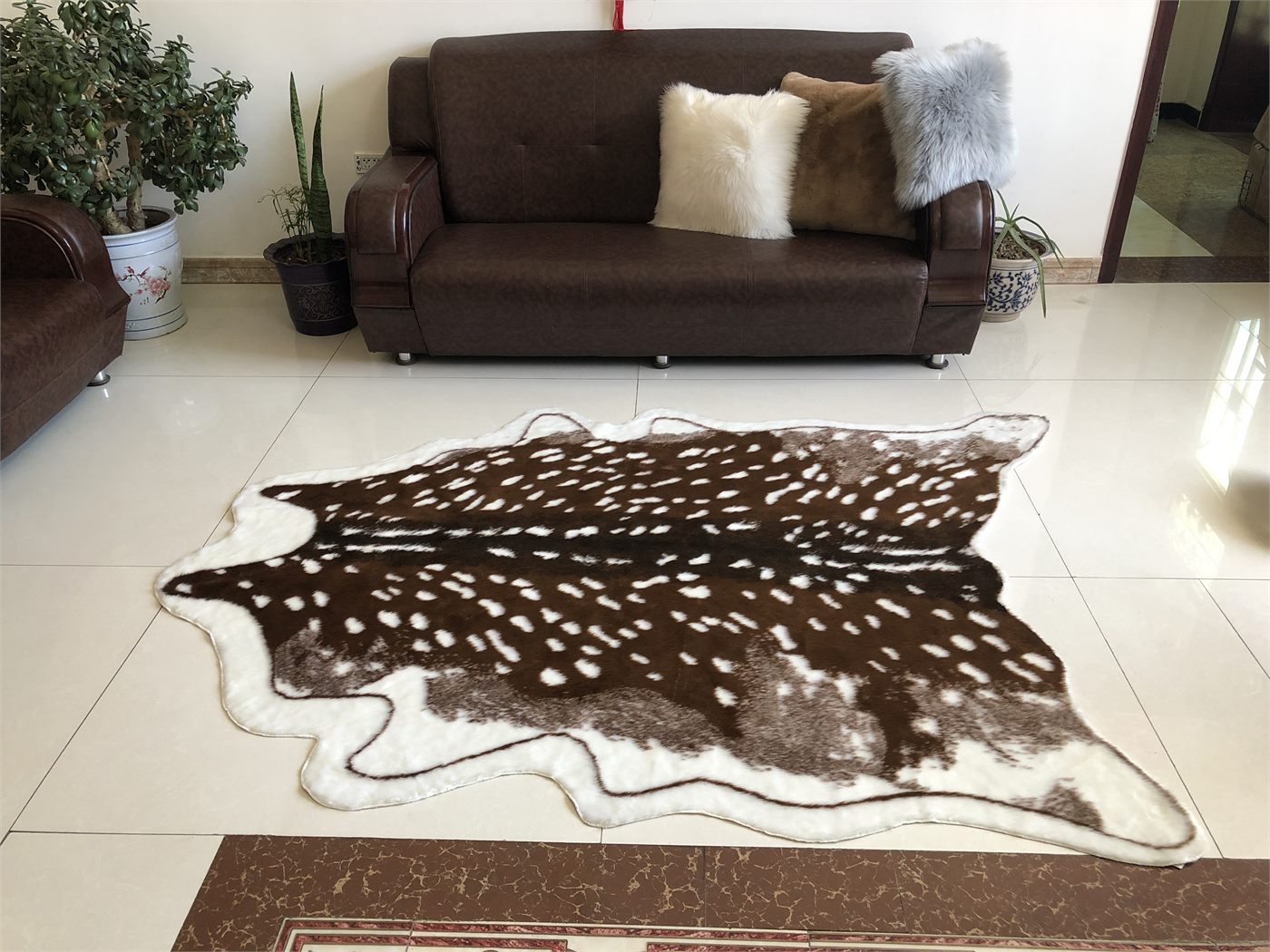 Animal print faux fur area rug shown in living room for wholesale sourcing