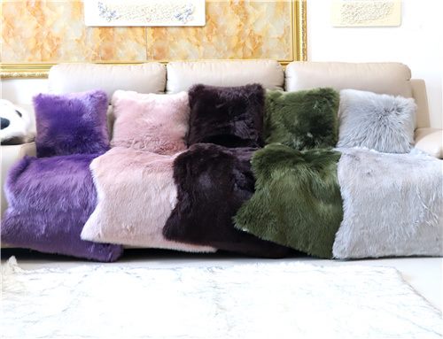 Faux fur cushions and sofa throw rugs arranged for custom home decor display