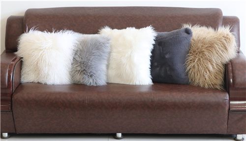 Faux fur cushions displayed on sofa for wholesale color and texture reference