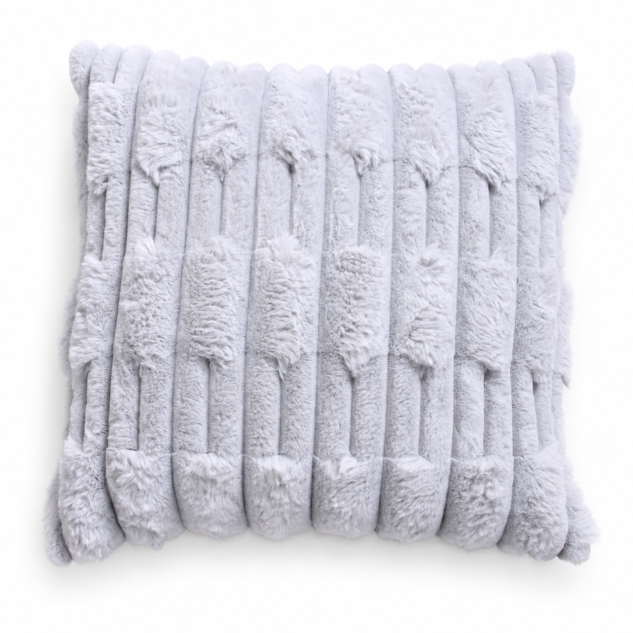 Close-up of a light grey faux fur cushion with raised geometric stripes