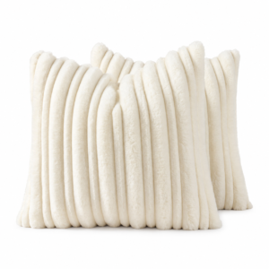 Two ivory faux fur cushions with raised vertical ribs on a white background